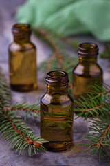 Fir tree essential oil in small bottles