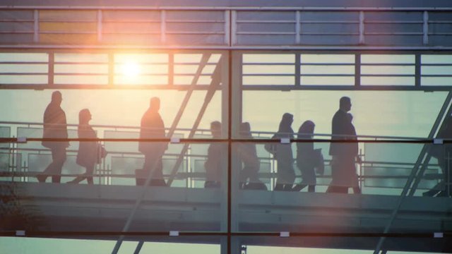 business people inside a modern glass building.