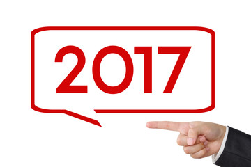 Businessman hand pointing 2017 sign on white background