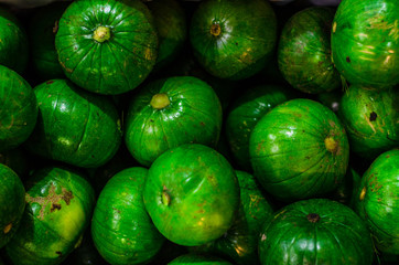 Fresh zapallito summer squash, traditional South American vegetable, on a market stall. Selective focus.