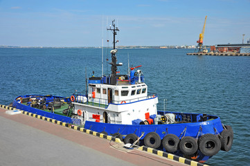 Tugboat in harbor quayside