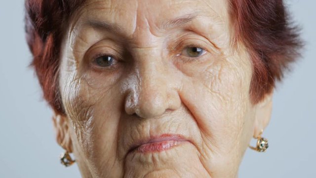 Portrait of very old woman, closeup view isolated on white