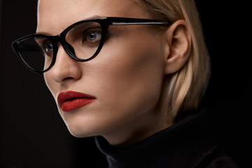 Fototapeta na wymiar Woman Wearing Fashion Glasses. Female With Red Lips In Eyewear