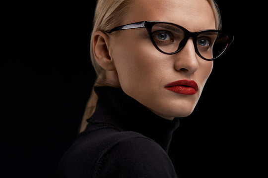 Woman Wearing Fashion Glasses. Female With Red Lips In Eyewear