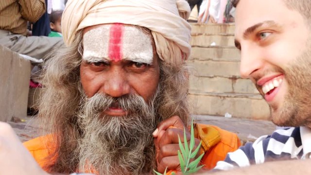 Tourist taking a selfie with Sadhu Holy Man in India