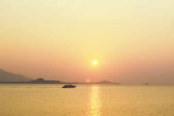 Fototapeta na wymiar Golden Sky and sea in sunset background