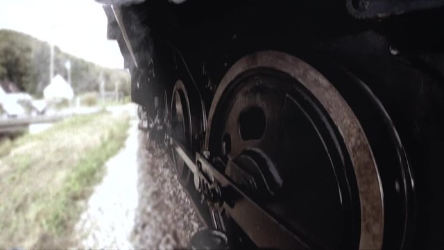 retro vintage background of old steam engine wheels. smoking locomotive.