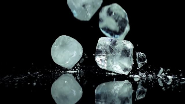 ice cubes dropping in super slow motion shot on high speed camera