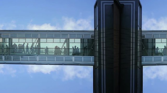 business people inside a modern glass building.
