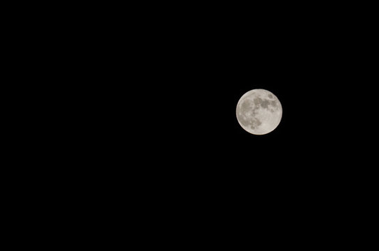 Full moon at night with black sky background