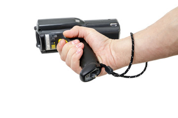 Man's hand holding a barcode scanner. The scanning device is directed to the left. Isolated on white background.