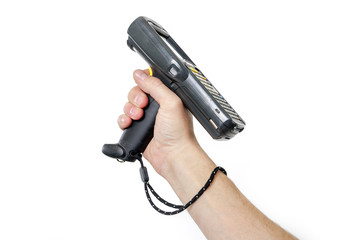 Man's hand holding a barcode scanner. The scanning device is directed upwards to the left. Isolated on white background.
