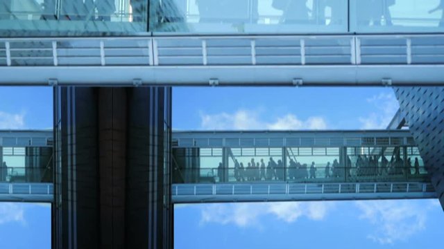 business people inside a modern glass building.