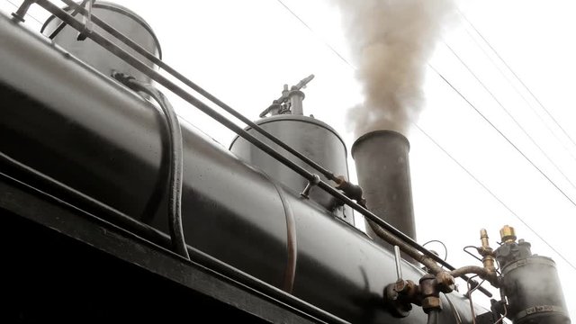 Historical steam engine train locomotive. old technology background. nostalgic retro vintage style.