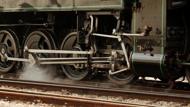 locomotive wheels in motion. old technology background.