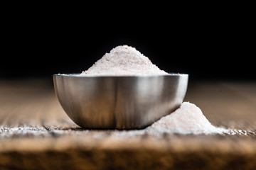 Himalayan Salt on wooden background (selective focus)