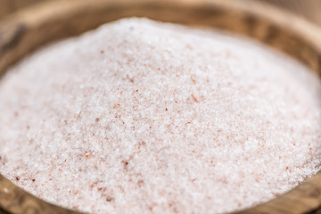 Wooden table with Pink Salt (selective focus)