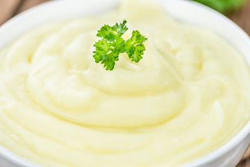 Mashed Potatoes (selective focus) on vintage wooden background