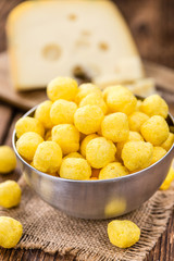Portion of Cheese Balls (fried) on wooden background (selective