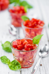 Diced Tomatoes (selective focus) on vintage wooden background