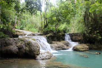 Beautiful blue water, jungle landscape, with small waterfalls