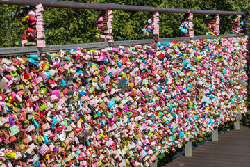 collection of colourful love locks on fence at Seoul Tower, South Korea