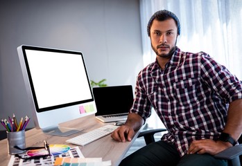 Serious hipster man posing for camera