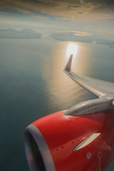 Sunrise on a plane window