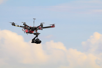 drone with professional camera flying