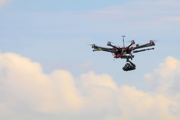 Fototapeta na wymiar drone with professional camera flying