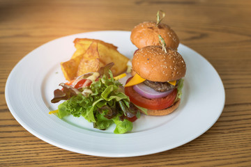Delicious hamburgers served on wooden planks