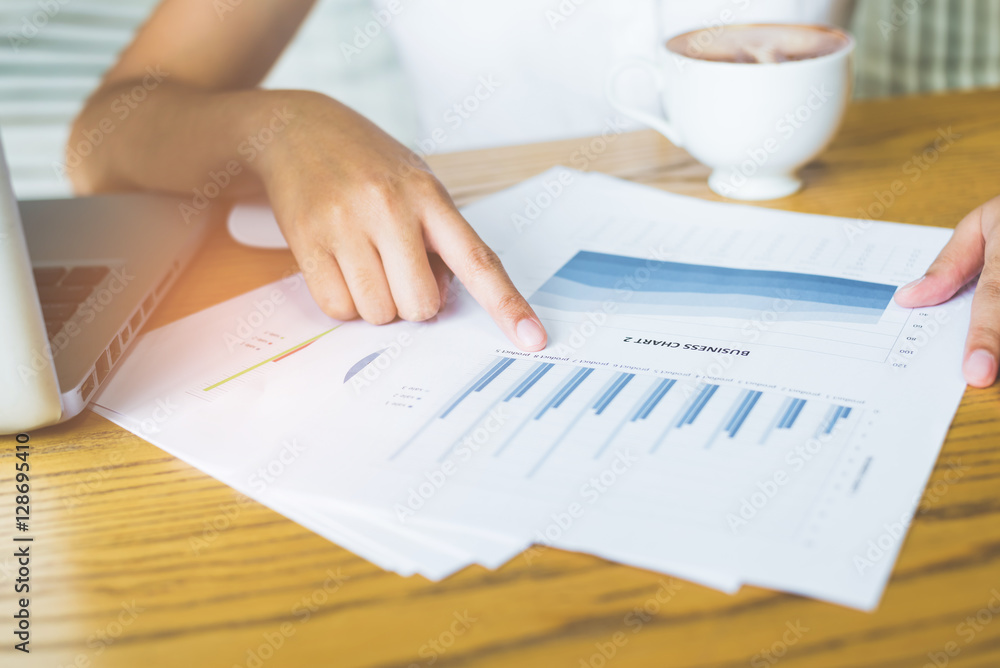 Poster image of hand pointing on a graph data