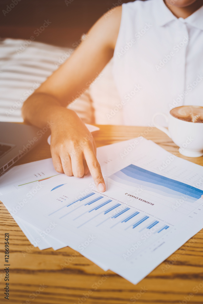 Poster image of hand pointing on a graph data
