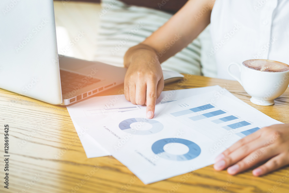 Poster image of hand pointing on a graph data