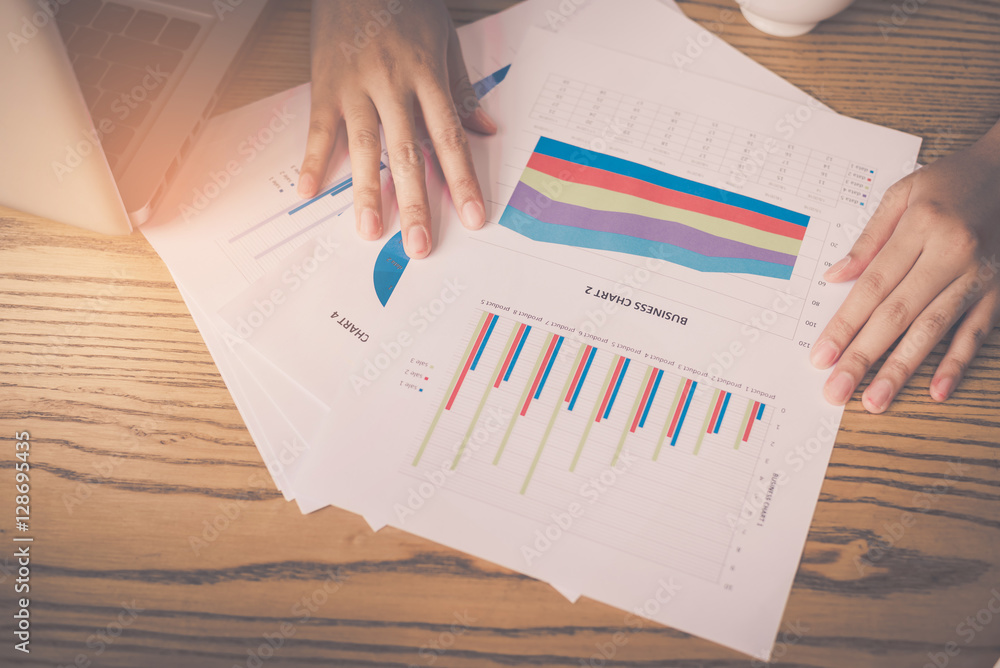 Poster image of hand pointing on a graph data