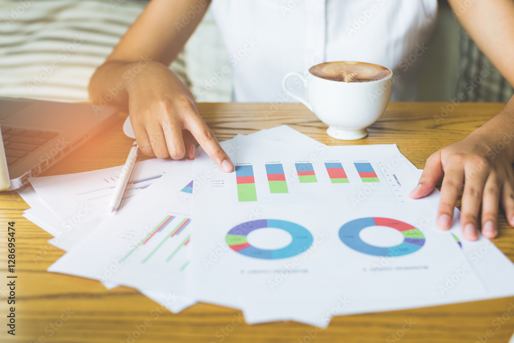 Poster image of hand pointing on a graph data
