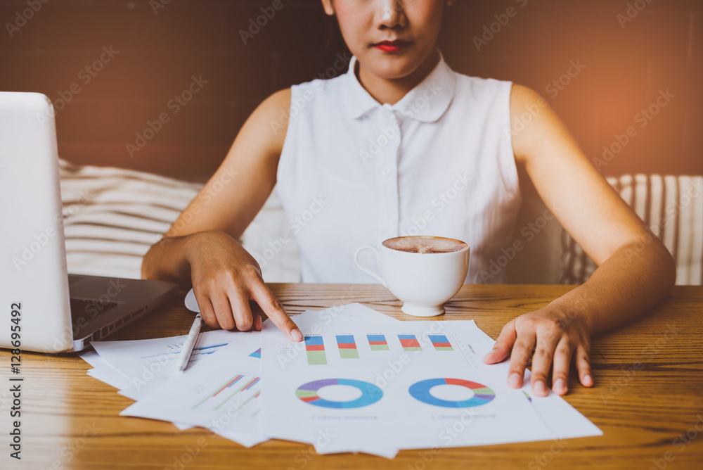 Poster image of hand pointing on a graph data