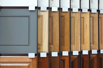 wood cabinet door samples in market in a row - obrazy, fototapety, plakaty