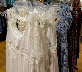 Different clothes on hangers close up.