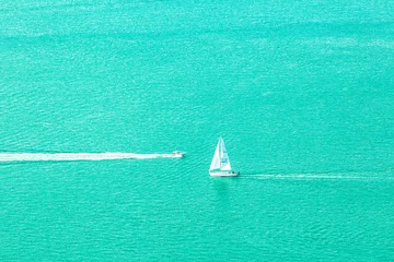 Zelfklevend Fotobehang Speed boat and sailboat. © mrcmos
