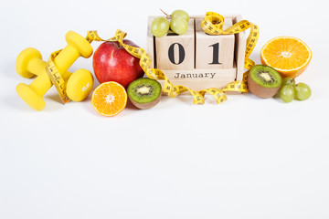 Cube calendar, fruits, dumbbells and tape measure, new years resolutions