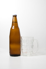 Brown beer bottle With empty beer glass