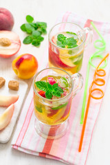 Cold peach tea with mint. Refreshing summer drink