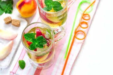 Cold peach tea with mint. Refreshing summer drink. Top view with