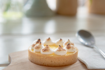 lemon tarts on wood plate