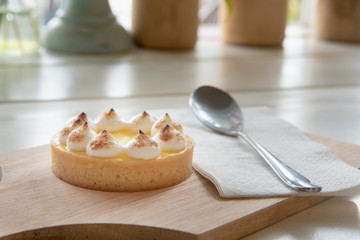 lemon tarts on wood plate