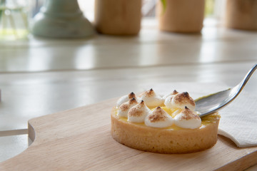 lemon tarts on wood plate
