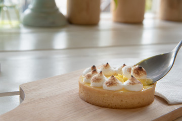lemon tarts on wood plate