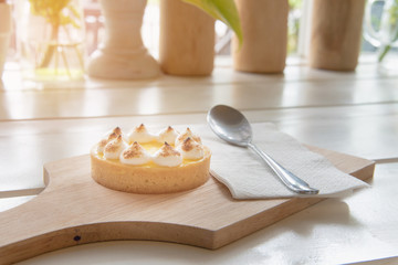 lemon tarts on wood plate