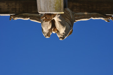 Fototapeta na wymiar View of the a Jesus Statue in the Calvario of Tandil City in Buenos Aires, Argentina against blue sky.